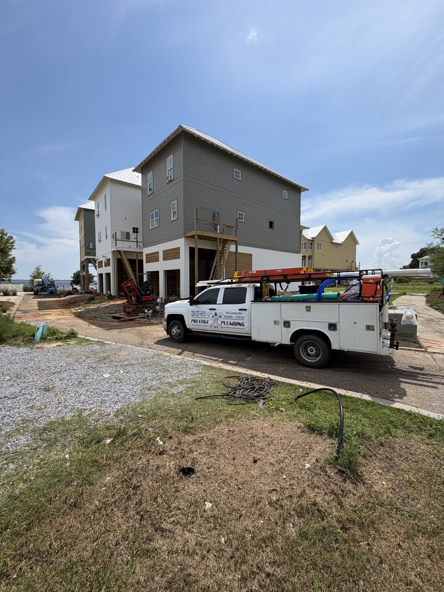 Prestige Plumbing LLC service truck on a Mississippi Gulf Coast jobsite