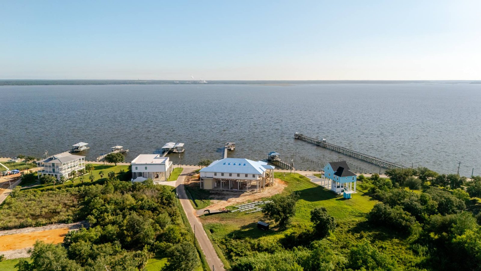 Aerial view of waterfront new construction homes on the Mississippi Gulf Coast